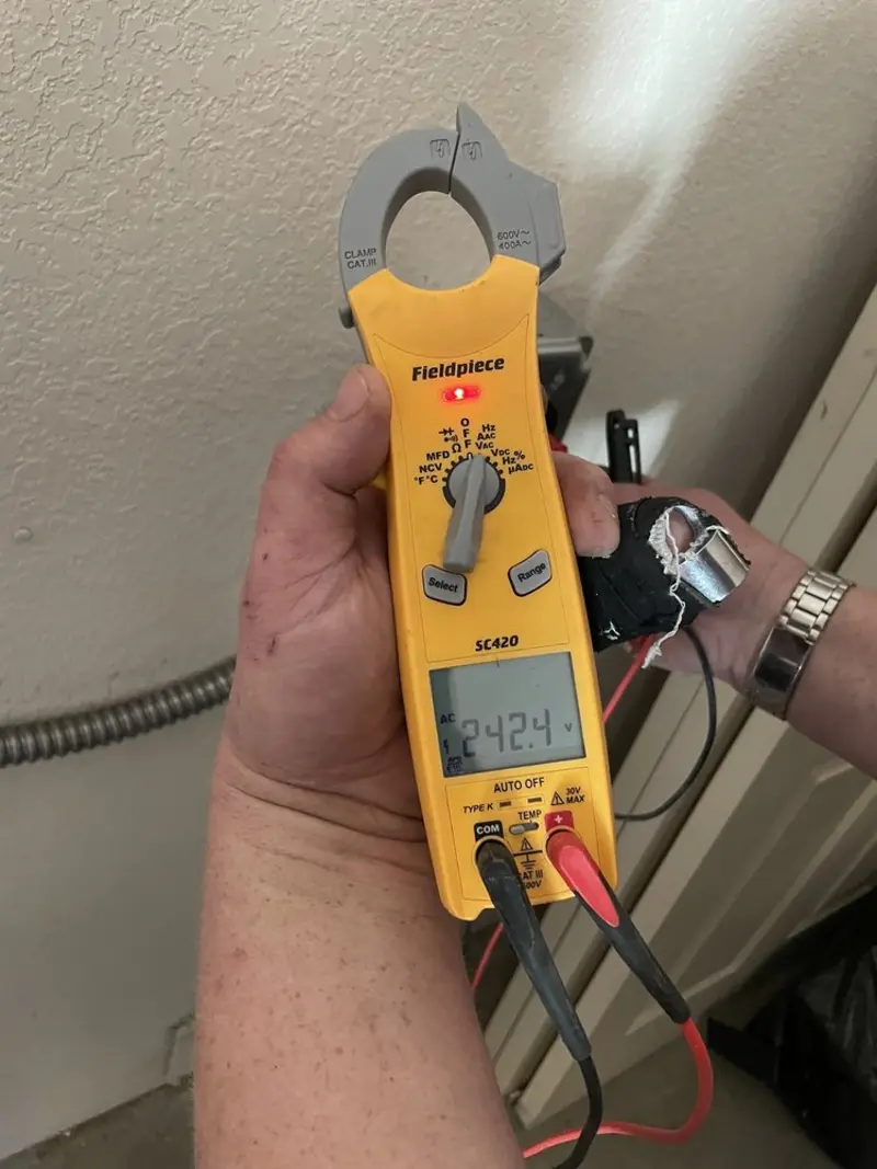 Voltage testing with clamp meter during Circuit Breaker Repair in Eunice